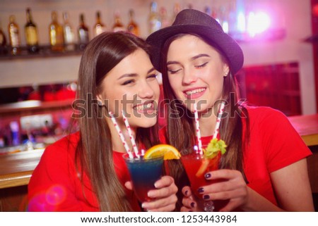 Two young girls lesbians at a party in the club.