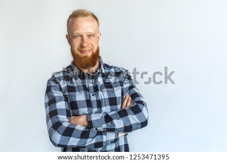 Red hair mature man standing isolated on grey wall crossed arms looking camera smiling happy