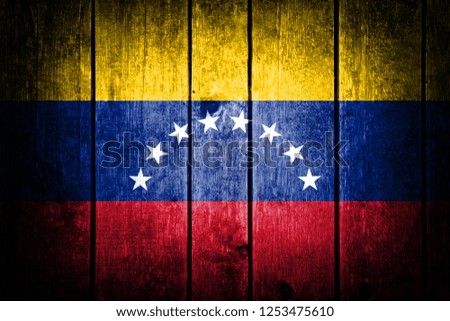 
Venezuelan flag
on a wooden background