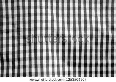 Square pattern black white fabric background.
Scott chintz fabric for design.
Plaid gray cotton knit texture.
top view.