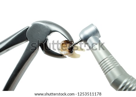 dental forceps and dental turbine tip decide to treat or remove tooth isolated on a white background Royalty-Free Stock Photo #1253511178
