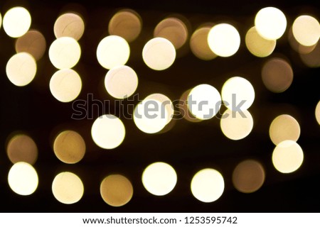Colorful bokeh of light on black background.
