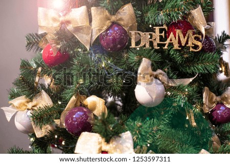 Happy new year. Christmas tree decorated with Christmas balls and toys. Shopping mall. Holidays mood. New year cards. 