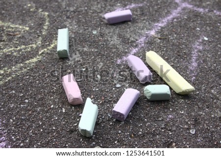 Colorful chalk on asphalt