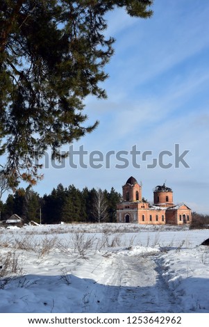 old building and pine forest in winter
