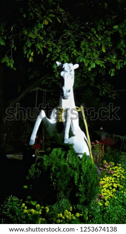 horse statue at night in garden