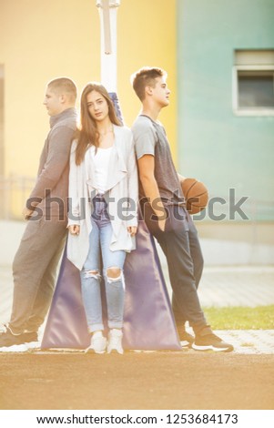 Three teenagers talking