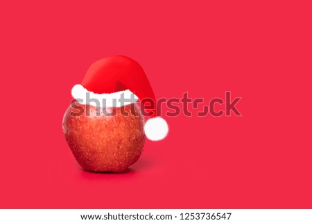 Designed Christmas-capped pineapples on a red background