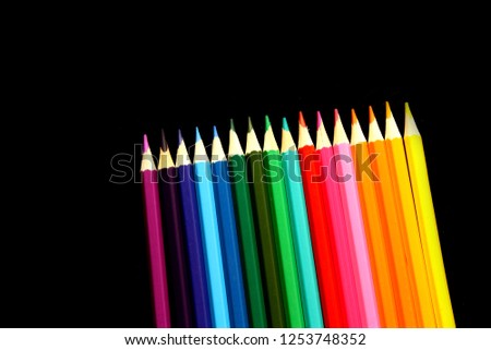 Variety color of colored pencils in black background