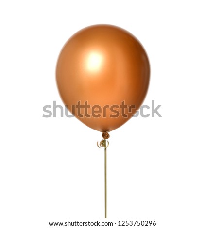Big round gold metallic latex balloon for birthday party isolated on a white background