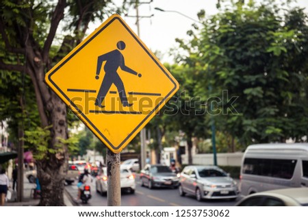 Cartoon traffic sign for crossing the road on yellow plate, Symbols for crossing the road
