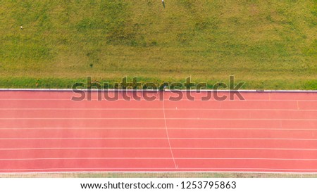 Stadium with running track. Top view from drone