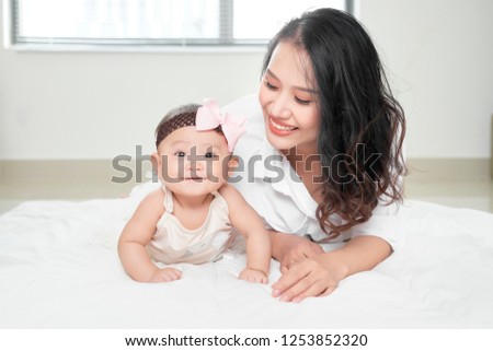 Mother playing with her baby