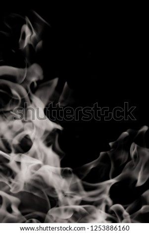 white smoke flame on a black background