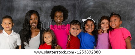 African American teacher and a group of students at school