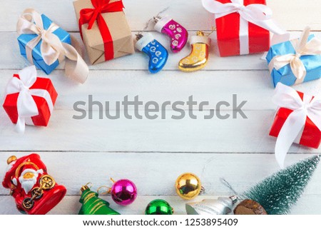 christmas or new year  frame composition with copy space in centre on light wooden background. Flat lay, top view, copy space