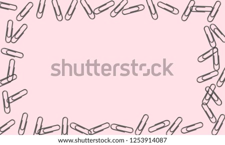 Creative stationery concept with with paperclip on pink background