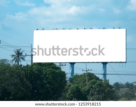 Blank billboard on blue sky background for new advertisement
