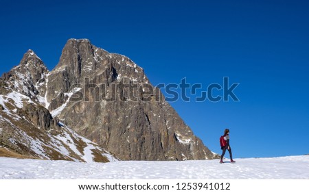 Girl walking in the Midi d'Ossau in the French Pyrenees.