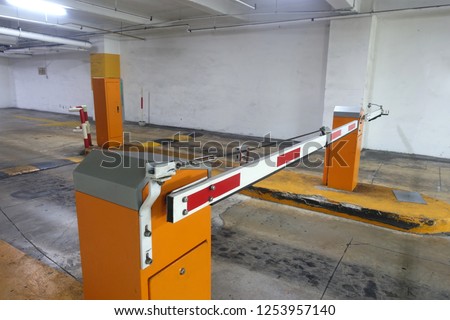 View of a boom gate car barrier before entering a private basement car park