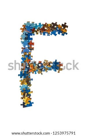 Letter F made of puzzle pieces isolated on white background