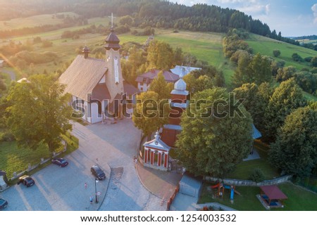 Old church in Tylicz aerial view Royalty-Free Stock Photo #1254003532