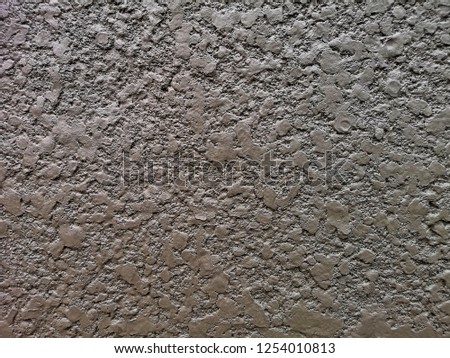 A textured gray wall, dried cement, abstract background