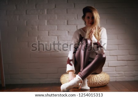 cozy Christmas evening girl / home New Year evening, model in a cozy house, evening light