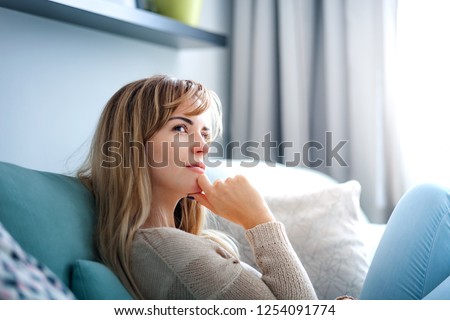 Woman at home deep in thoughts thinking and planning Royalty-Free Stock Photo #1254091774