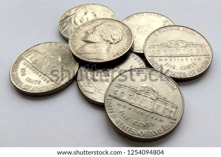Close up American 5 cent coins usa on white background