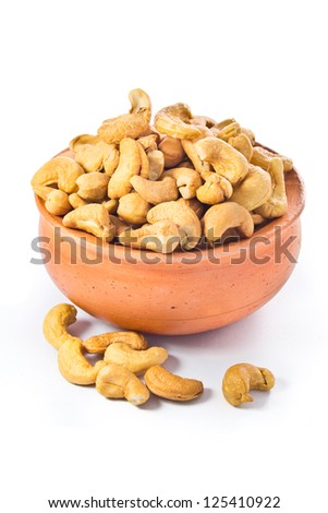 cashews nut in bowl on white background Royalty-Free Stock Photo #125410922
