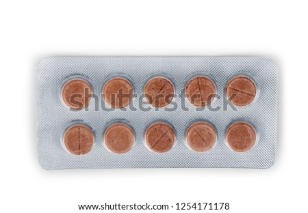 Pills in a pack on a white background