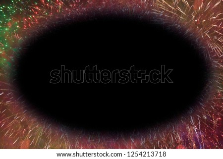 Colorful fireworks with black oval copy space glowing edges in the middle