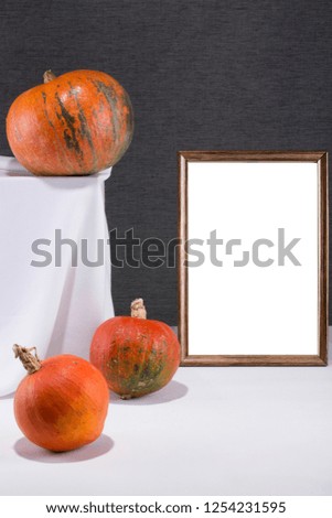 Photo frame for your mock-up on the table with pumpkins
