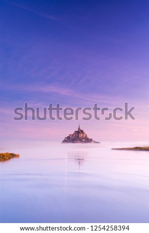 blue silent morning around castle in fog in France