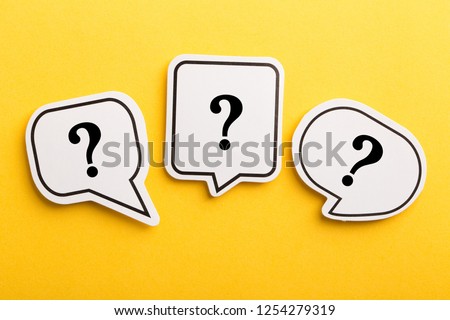 Question mark speech bubble isolated on yellow background. Royalty-Free Stock Photo #1254279319