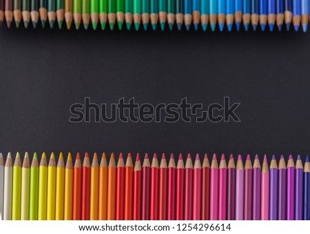 Set Of Colored Pencils of cold tones On A Black Background. Mock-up