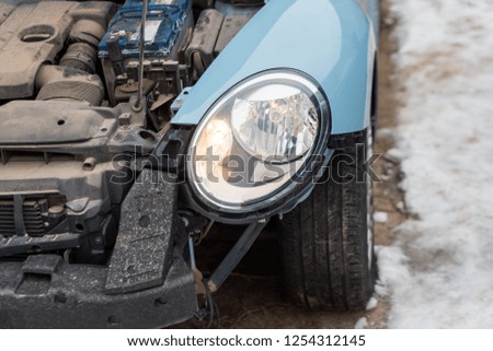 Close up of a crashed car. Auto crash, wreck with damage injury. Street, traffic collision. Broken metal. Automobile insurance, safety, repair and transportation. Road dangerous drive.