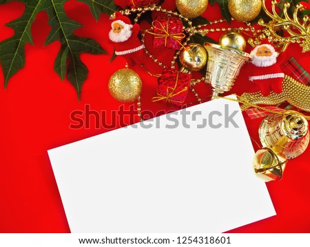 merry christmas and happy new year, gifts and white card on red background,New year concept.