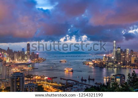 Victoria harbor view from Victoria peak viewpoint with twilight sky 