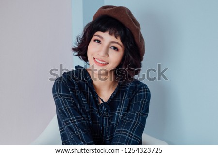 Asian girls are cute and adorable smile in a house with pink walls. Youngsters who are happy college students, modern lifestyle or fashion ad ideas for women.