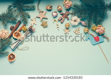 Christmas decorations over blue background/top view/toned photo