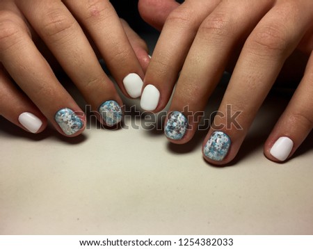 Fashionable manicure in white with a New Year snowflake design