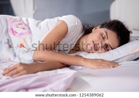 Picture of beautiful woman sleeping well on the comfortable bed. Shot at home