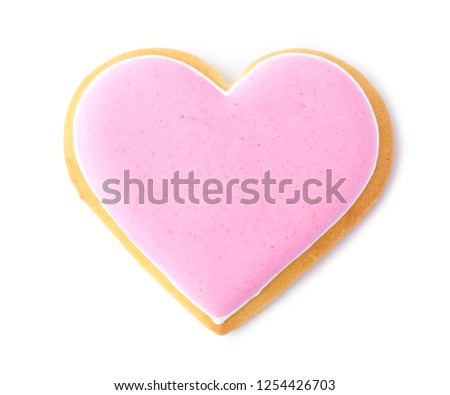 Decorated heart shaped cookie on white background, top view