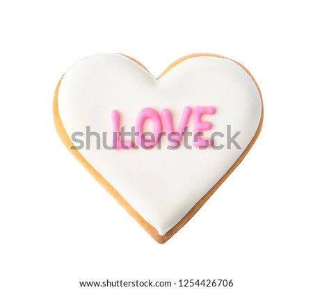 Decorated heart shaped cookie with word LOVE on white background, top view. Valentine's day treat