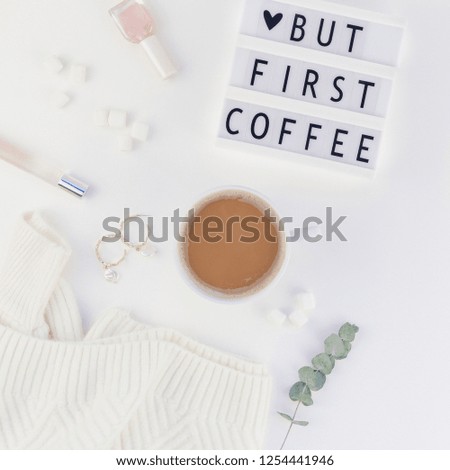 Creative autumn flat lay overhead top view coffee cup vintage lightbox But coffee first text sweater white background copy space minimal style Fall winter season template feminine blog social media