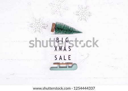 Creative Top view flat lay promotion composition Big Xmas sale text lightbox white wooden background copy space Template seasonal winter christmas offer promotion advertising scandinavian minimalism