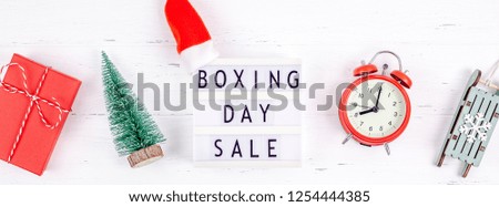 Creative Top view flat lay promotion composition Boxing day sale text on lightbox white background copy space Template Boxing day sale mockup winter christmas seasonal offer promotion advertising Royalty-Free Stock Photo #1254444385