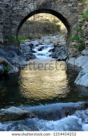 Medieval stone bridge over the river Hurdano in Casarrubia village. Las Hurdes is a mountanious region of the north of Caceres province, Extremadura, Spain Royalty-Free Stock Photo #1254454252